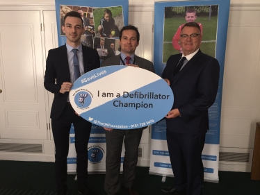 Chris Green, MP for Bolton West, with Jake Morrison, Chief Executive of The Oliver King Foundation, and Mark King, father of Oliver King